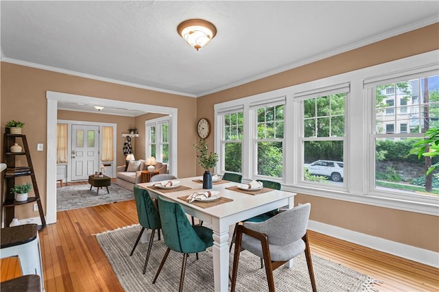203 W Hutchinson Ave, Regent Square, PA 15218 - dining area with healthy amount of natural light, light wood-style floors, and ornamental molding