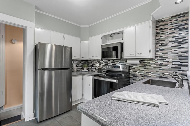 203 W Hutchinson Ave, Regent Square, PA 15218 - kitchen with appliances with stainless steel finishes, tile patterned flooring, white cabinets, tasteful backsplash, and crown molding