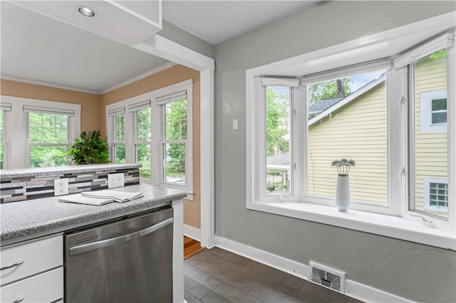 203 W Hutchinson Ave, Regent Square, PA 15218 - kitchen with stainless steel dishwasher, crown molding, decorative backsplash, light countertops, and white cabinets