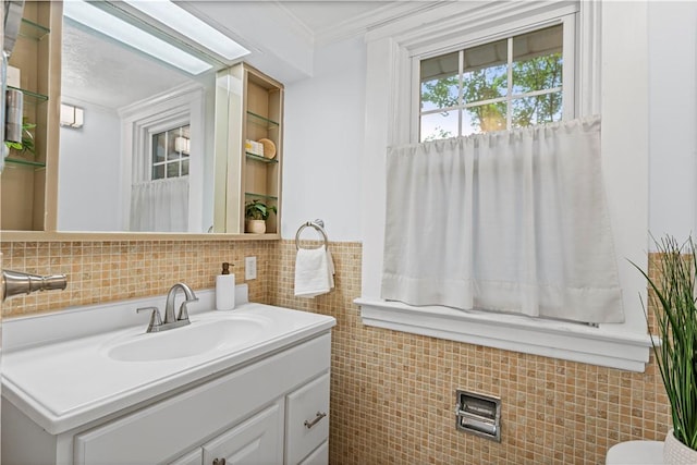 203 W Hutchinson Ave, Regent Square, PA 15218 - bathroom featuring tile walls, vanity, and crown molding