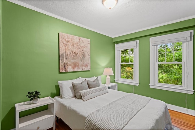 203 W Hutchinson Ave, Regent Square, PA 15218 - bedroom with ornamental molding, wood finished floors, and a textured ceiling