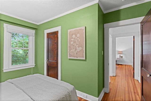 203 W Hutchinson Ave, Regent Square, PA 15218 - bedroom with light wood-type flooring and ornamental molding