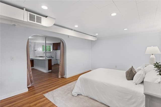 203 W Hutchinson Ave, Regent Square, PA 15218 - bedroom with arched walkways, wood finished floors, and recessed lighting