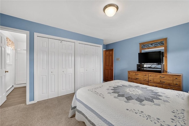 1990 Robbins Station Rd, North Huntingdon, PA 15642 - carpeted bedroom with two closets and a baseboard heating unit