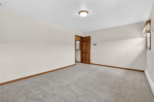 1990 Robbins Station Rd, North Huntingdon, PA 15642 - carpeted empty room featuring a baseboard heating unit and baseboards