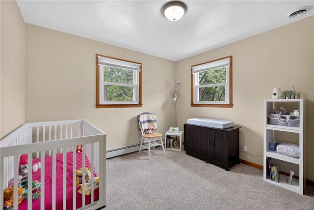 1990 Robbins Station Rd, North Huntingdon, PA 15642 - carpeted bedroom featuring baseboard heating, multiple windows, and a crib