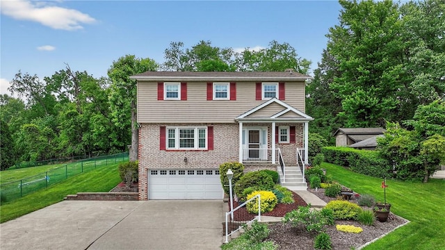 1990 Robbins Station Rd, North Huntingdon, PA 15642 - colonial house with driveway, an attached garage, and brick siding