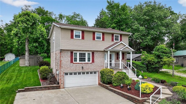 1990 Robbins Station Rd, North Huntingdon, PA 15642 - colonial home featuring a shed, concrete driveway, a garage, a front yard, and brick siding