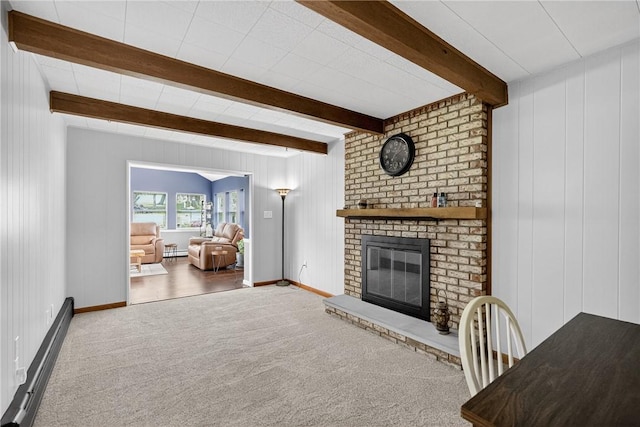 1990 Robbins Station Rd, North Huntingdon, PA 15642 - unfurnished living room featuring carpet floors, beam ceiling, a fireplace, and a baseboard radiator
