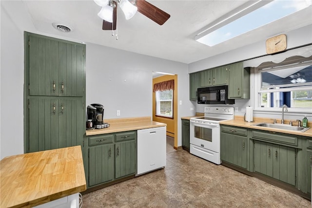 1990 Robbins Station Rd, North Huntingdon, PA 15642 - kitchen featuring green cabinetry, white appliances, and a ceiling fan