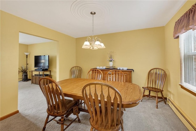 1990 Robbins Station Rd, North Huntingdon, PA 15642 - dining area with a baseboard radiator, carpet flooring, and a chandelier