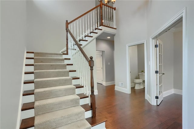 109 Summer Ln, Mount Pleasant Twp Was, PA 15057 - stairway featuring wood finished floors, a towering ceiling, and a chandelier
