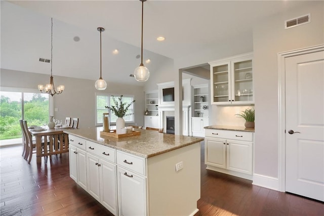 109 Summer Ln, Mount Pleasant Twp Was, PA 15057 - kitchen with vaulted ceiling, dark wood-style floors, glass insert cabinets, plenty of natural light, and recessed lighting