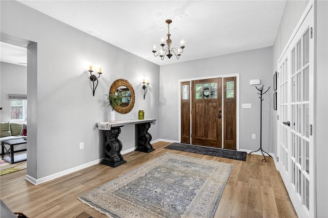 711 SE Simpson Howell, Elizabeth Twp/Boro, PA 15037 - entrance foyer with wood finished floors and a chandelier