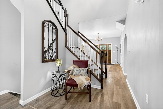 711 SE Simpson Howell, Elizabeth Twp/Boro, PA 15037 - foyer featuring light wood-style flooring, stairway, and a chandelier