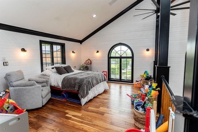 33 Chalkhill Ohiopyle Rd, Wharton Twp, PA 15470 - bedroom featuring lofted ceiling, ornamental molding, multiple windows, wooden walls, and light wood-type flooring