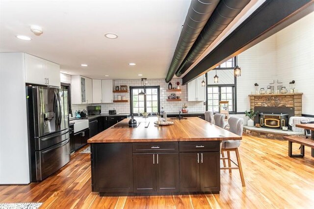 33 Chalkhill Ohiopyle Rd, Wharton Twp, PA 15470 - kitchen with butcher block counters, stainless steel fridge with ice dispenser, open shelves, white cabinetry, and light wood-type flooring