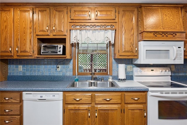 137 Painter Rd, Rayburn Twp, PA 16259 - kitchen with white appliances, brown cabinets, and tasteful backsplash