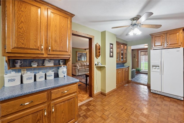 137 Painter Rd, Rayburn Twp, PA 16259 - kitchen with white fridge with ice dispenser, brown cabinets, and ceiling fan