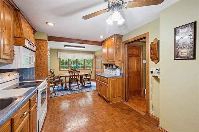 137 Painter Rd, Rayburn Twp, PA 16259 - kitchen with white appliances, brown cabinets, ceiling fan, decorative backsplash, and dark countertops