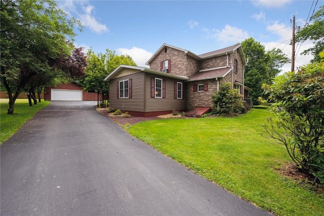 137 Painter Rd, Rayburn Twp, PA 16259 - view of front of home featuring a garage, a front lawn, and an outbuilding