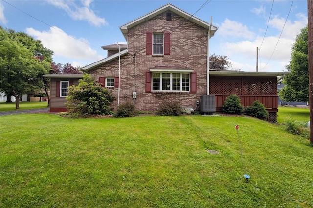 137 Painter Rd, Rayburn Twp, PA 16259 - rear view of house featuring brick siding and a lawn