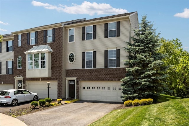 118 Maple Ridge Dr, Cecil, PA 15317 - view of property with an attached garage, asphalt driveway, and brick siding