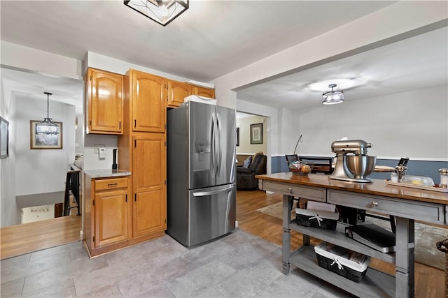 3102 Albine Dr, Shaler, PA 15116 - kitchen with stainless steel fridge, light countertops, and brown cabinetry