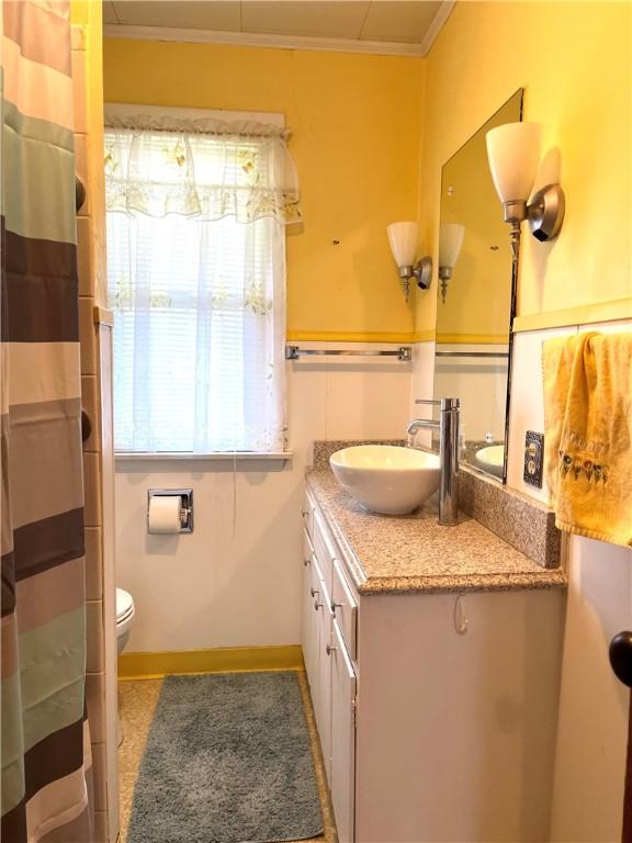 231 Center St, Slippery Rock Boro, PA 16057 - bathroom with vanity, ornamental molding, and a shower with curtain