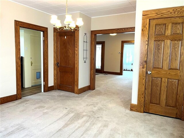 231 Center St, Slippery Rock Boro, PA 16057 - empty room with a chandelier, light colored carpet, and crown molding