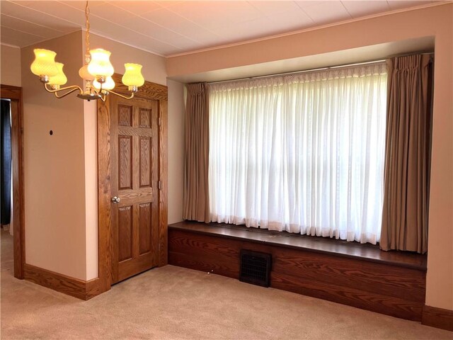 231 Center St, Slippery Rock Boro, PA 16057 - unfurnished dining area featuring a chandelier, light carpet, crown molding, and healthy amount of natural light