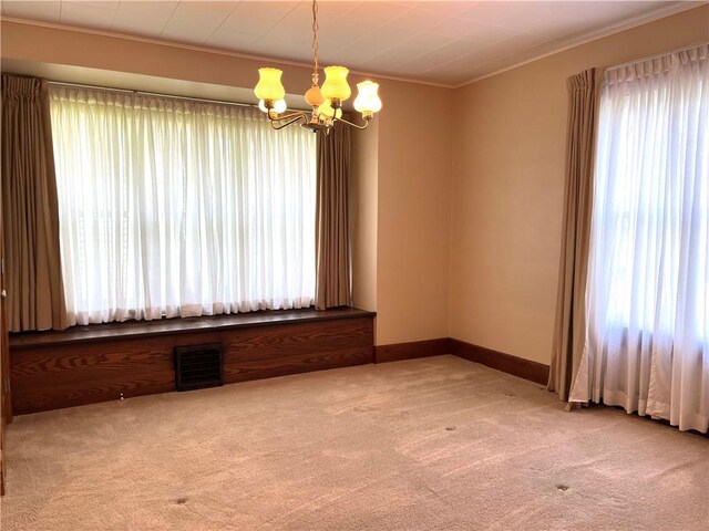 231 Center St, Slippery Rock Boro, PA 16057 - carpeted empty room with a chandelier and ornamental molding