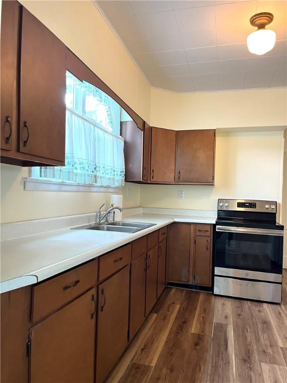 231 Center St, Slippery Rock Boro, PA 16057 - kitchen with stainless steel range with electric stovetop, light countertops, and dark wood-type flooring
