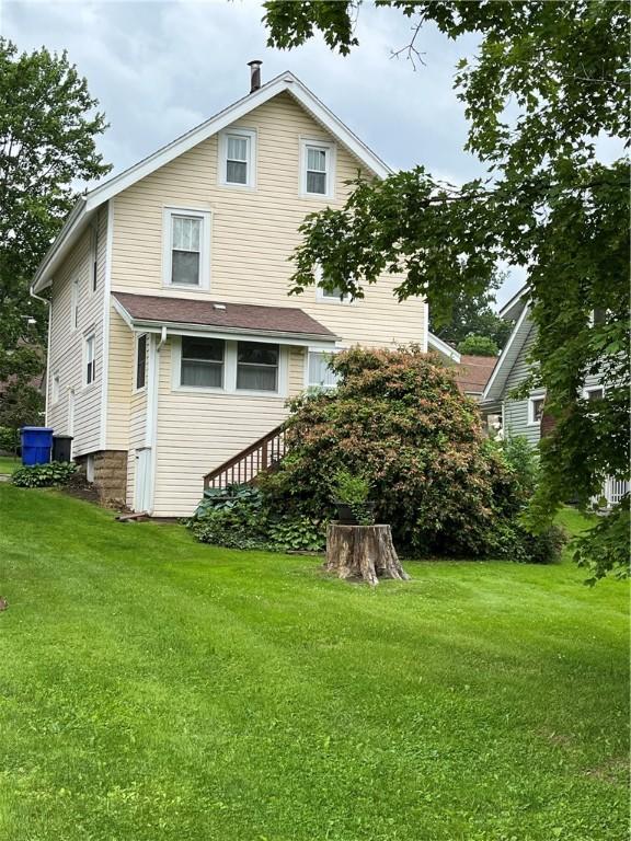 231 Center St, Slippery Rock Boro, PA 16057 - rear view of house with a yard
