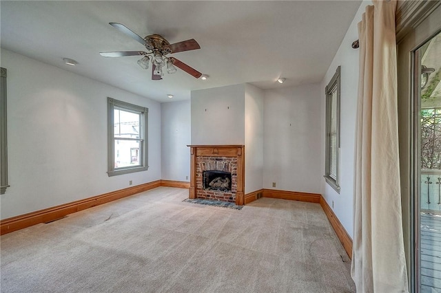 1457 Orator St, Crafton Heights, PA 15204 - unfurnished living room featuring plenty of natural light, light carpet, a ceiling fan, and a brick fireplace