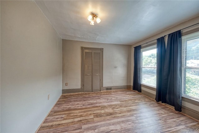 1457 Orator St, Crafton Heights, PA 15204 - empty room with wood finished floors and healthy amount of natural light