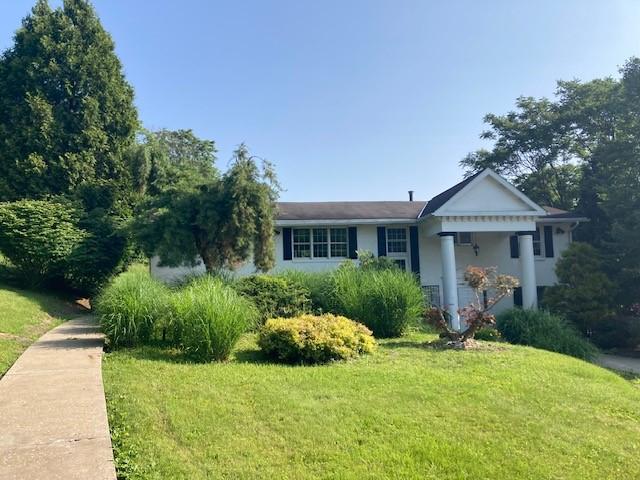 1014 State Rd, Monessen, PA 15062 - view of front facade featuring a front yard and stucco siding
