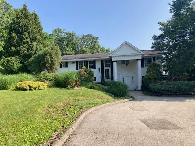 1014 State Rd, Monessen, PA 15062 - view of front of house with a front lawn and stucco siding