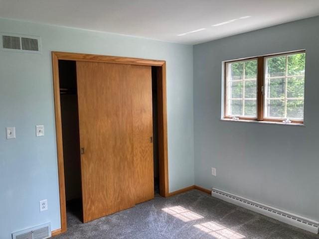 1014 State Rd, Monessen, PA 15062 - unfurnished bedroom with a baseboard heating unit, a closet, and carpet