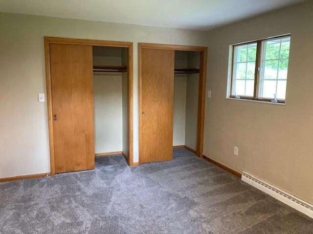 1014 State Rd, Monessen, PA 15062 - unfurnished bedroom with a baseboard heating unit, two closets, and carpet flooring