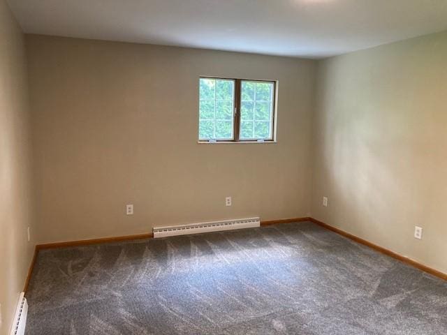 1014 State Rd, Monessen, PA 15062 - spare room featuring a baseboard heating unit, a baseboard radiator, and carpet