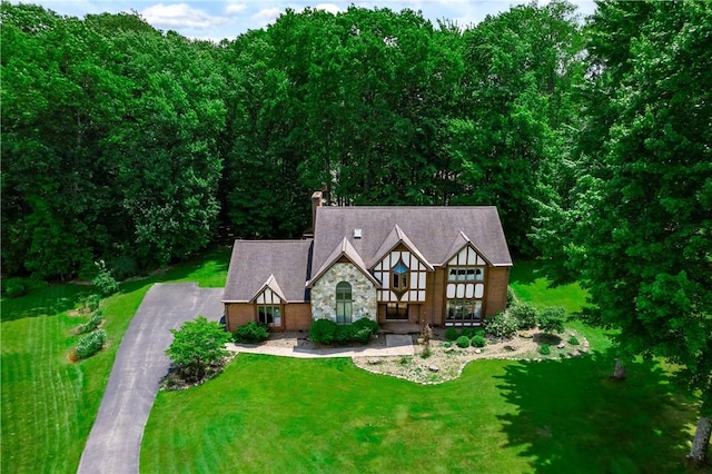 109 Old Hickory Ln, Pine Twp Mer, PA 16127 - view of front of property with stone siding, a front lawn, driveway, and a chimney