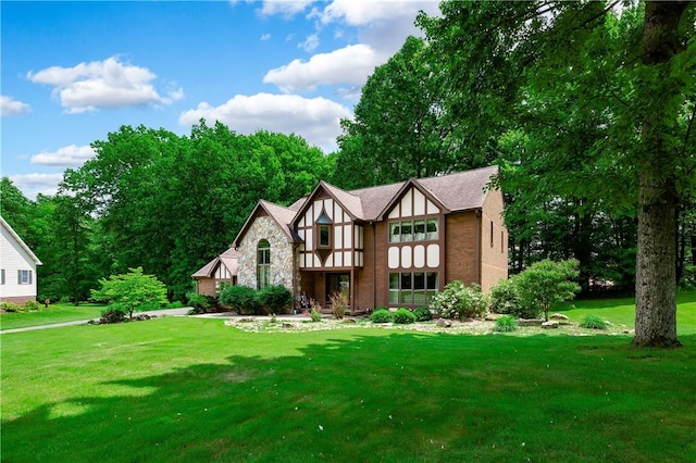 109 Old Hickory Ln, Pine Twp Mer, PA 16127 - tudor home with a front yard, stone siding, and brick siding