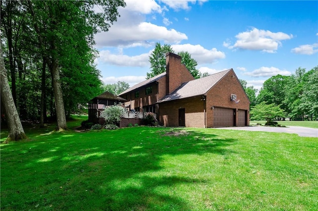 109 Old Hickory Ln, Pine Twp Mer, PA 16127 - view of side of property with a detached garage, a chimney, brick siding, and a lawn
