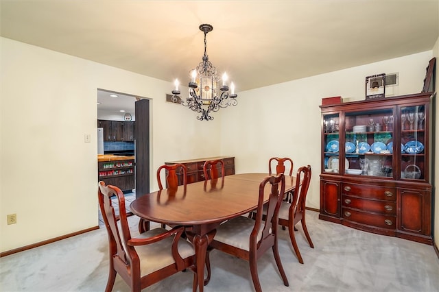 124 Oak Ln, Adams Twp, PA 16046 - dining room with light colored carpet and a chandelier