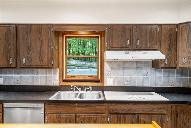 124 Oak Ln, Adams Twp, PA 16046 - kitchen with dishwasher, under cabinet range hood, dark countertops, and decorative backsplash