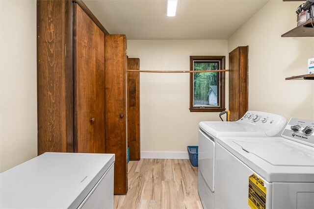 124 Oak Ln, Adams Twp, PA 16046 - laundry area with washer and dryer and light wood-style flooring