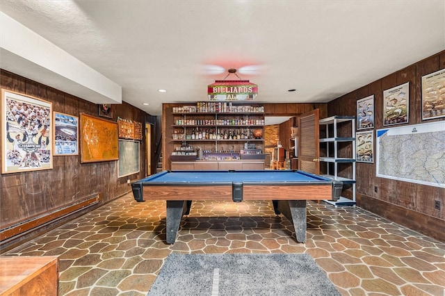 124 Oak Ln, Adams Twp, PA 16046 - recreation room featuring wooden walls, stone flooring, pool table, and a dry bar
