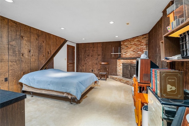 124 Oak Ln, Adams Twp, PA 16046 - carpeted bedroom featuring wooden walls, a fireplace, and recessed lighting