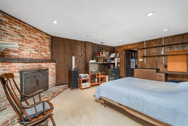 124 Oak Ln, Adams Twp, PA 16046 - bedroom with wood walls, light carpet, a fireplace, and recessed lighting